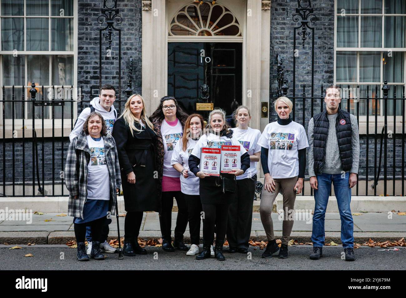 London, UK. 13th Nov, 2024. Members of the 'Road To Justice : 50 Years of Suffering In Silence' campaign hand in a petition in Downing Street. The campaign highlights the plight of children affected by epilepsy drug Sodium Valproate, which caused birth defects, and has been fighting for compensation for several decades. Credit: Imageplotter/Alamy Live News Stock Photo