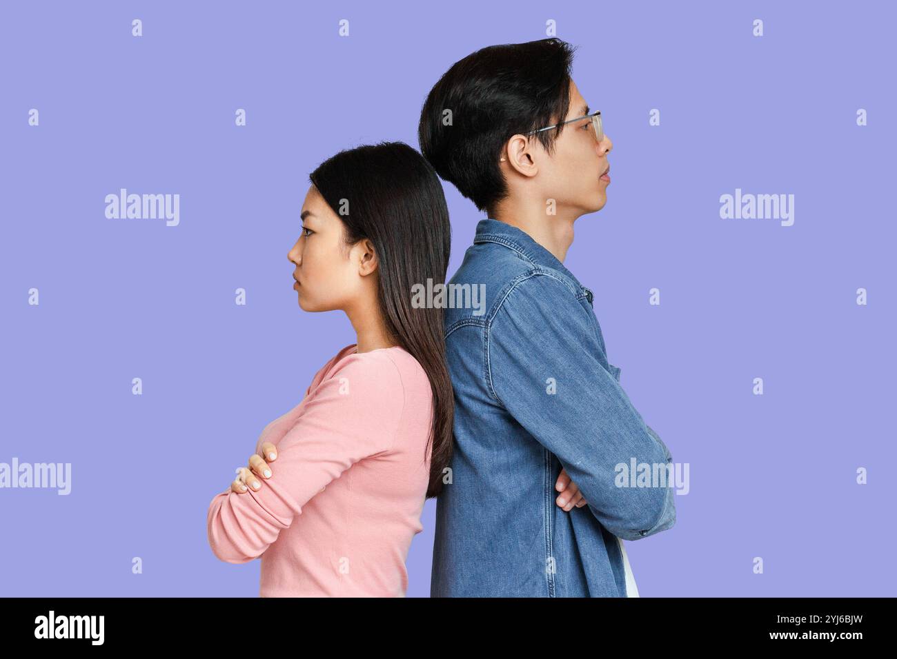 Staying Back We dont talk anymore. Sad asian man and woman staying back to back over ...