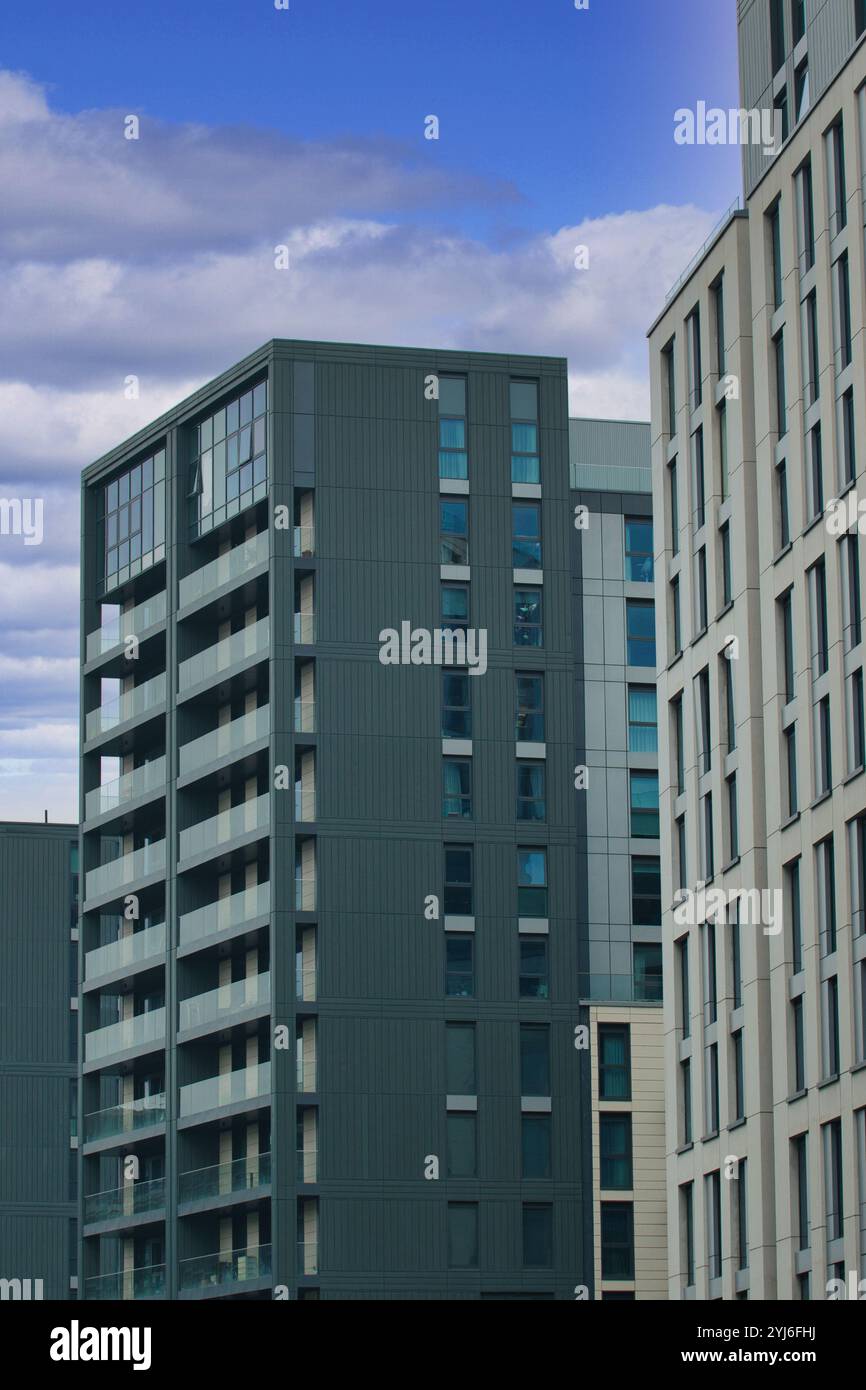 Tall City Apartment Buildings With Oversized Windows photo