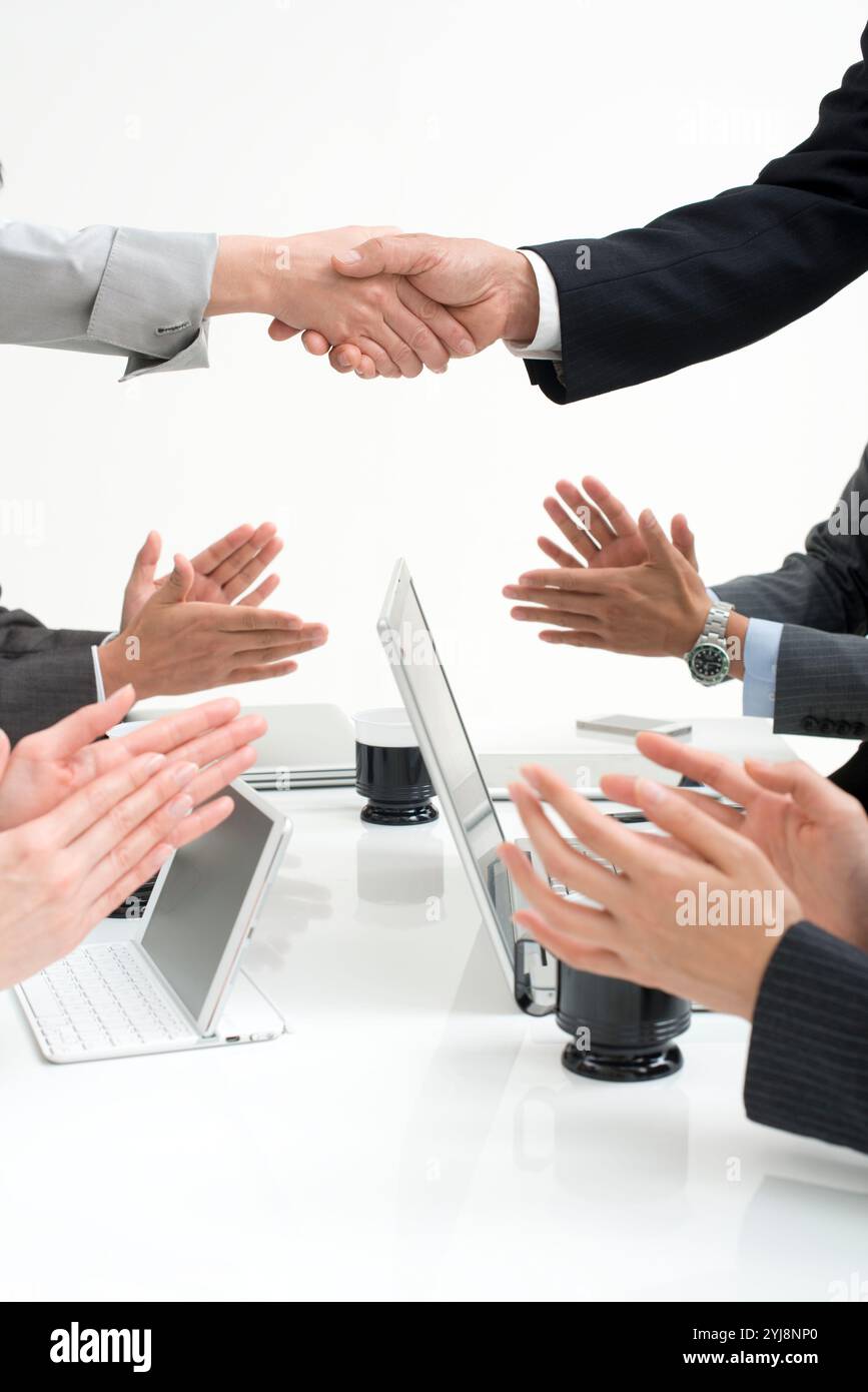 Businessperson clapping hands shaking hands Stock Photo - Alamy