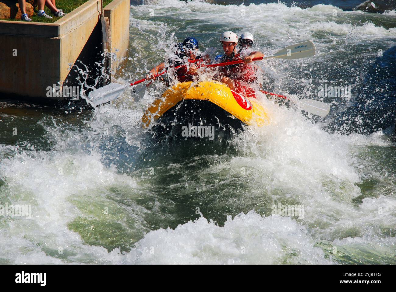 A group of thrill seekers take on an adventuring riding the rapids at the Whitewater Center in Charlotte, North Carolina Stock Photo