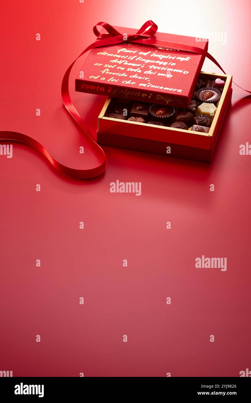 Red boxes, ribbons and chocolates Stock Photo - Alamy