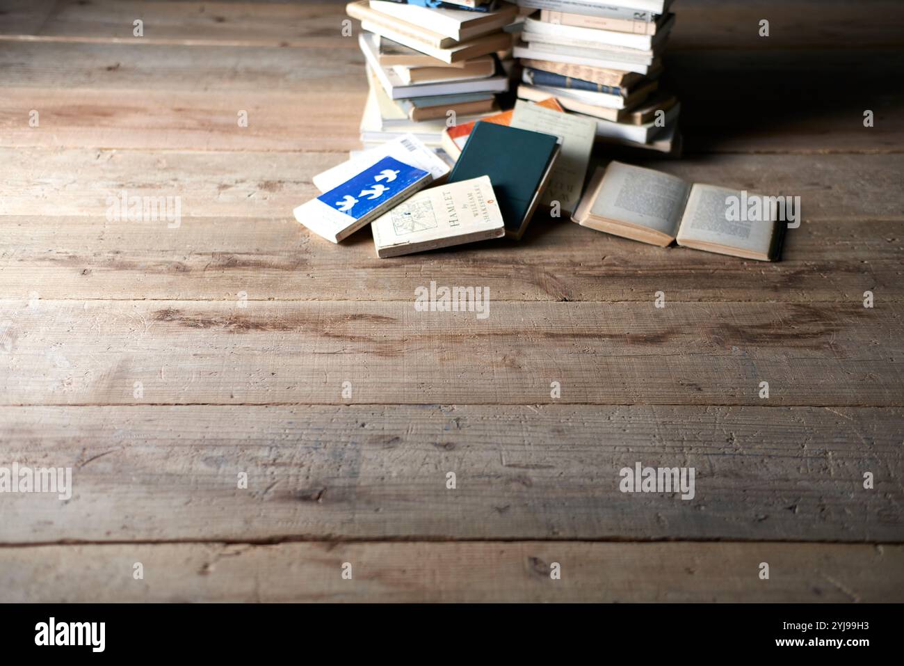 Piles of books on the floor Stock Photo