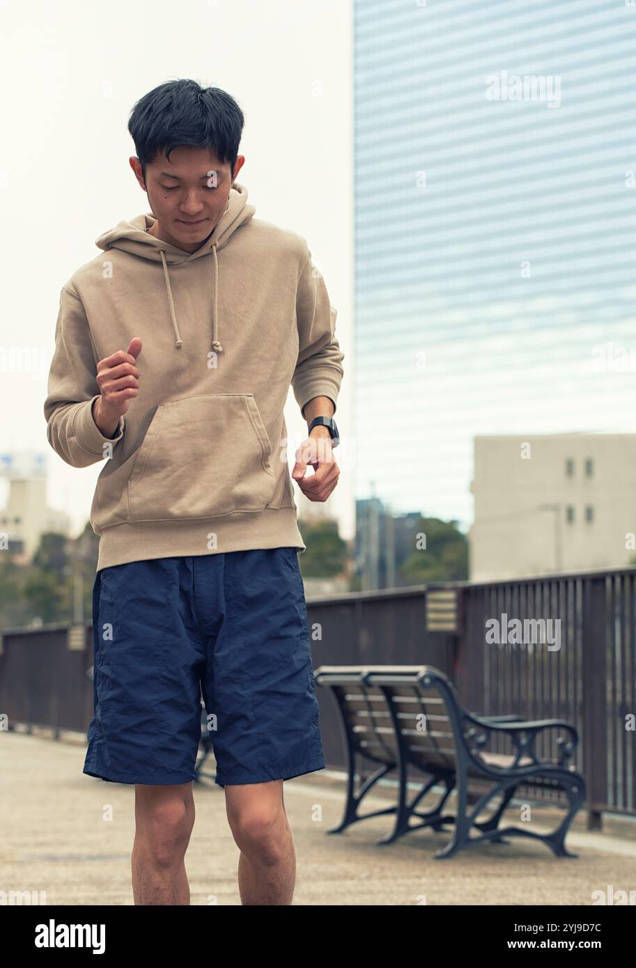 Man running with smartwatch Stock Photo - Alamy