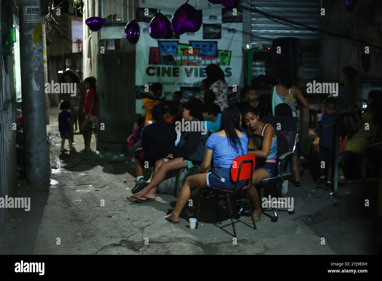 Rio De Janeiro, Brazil. 16th Oct, 2022. Residents of Vidigal's favela in Rio de Janeiro watch a film projected on an alley wall. For people living in the favelas of Rio de Janeiro, Brazil, going to the movies is an expensive and remote pastime. So every week, an associative film club offers an open-air screening in the Vidigal favela. (Credit Image: © Apolline Guillerot-Malick/SOPA Images via ZUMA Press Wire) EDITORIAL USAGE ONLY! Not for Commercial USAGE! Stock Photo