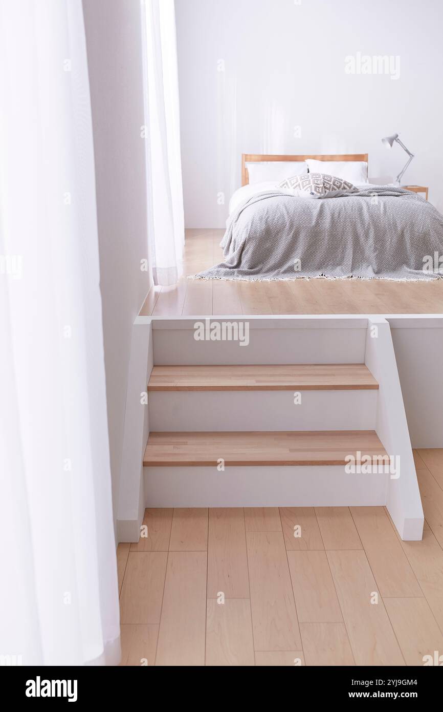 Room With Step Simple bedroom with step floor Stock Photo - Alamy
