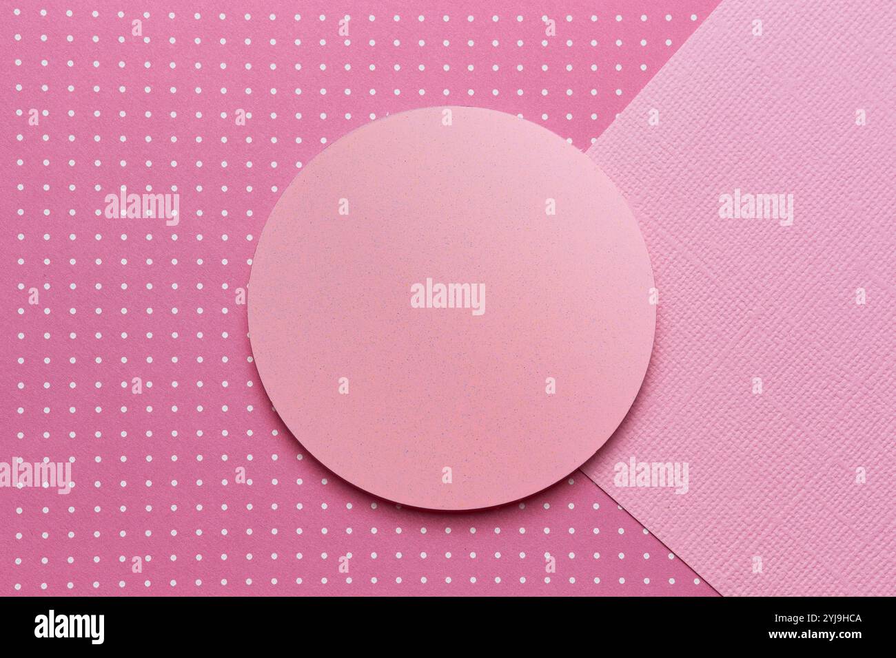 Round stand and two sheets of paper in pink stock photo alamy