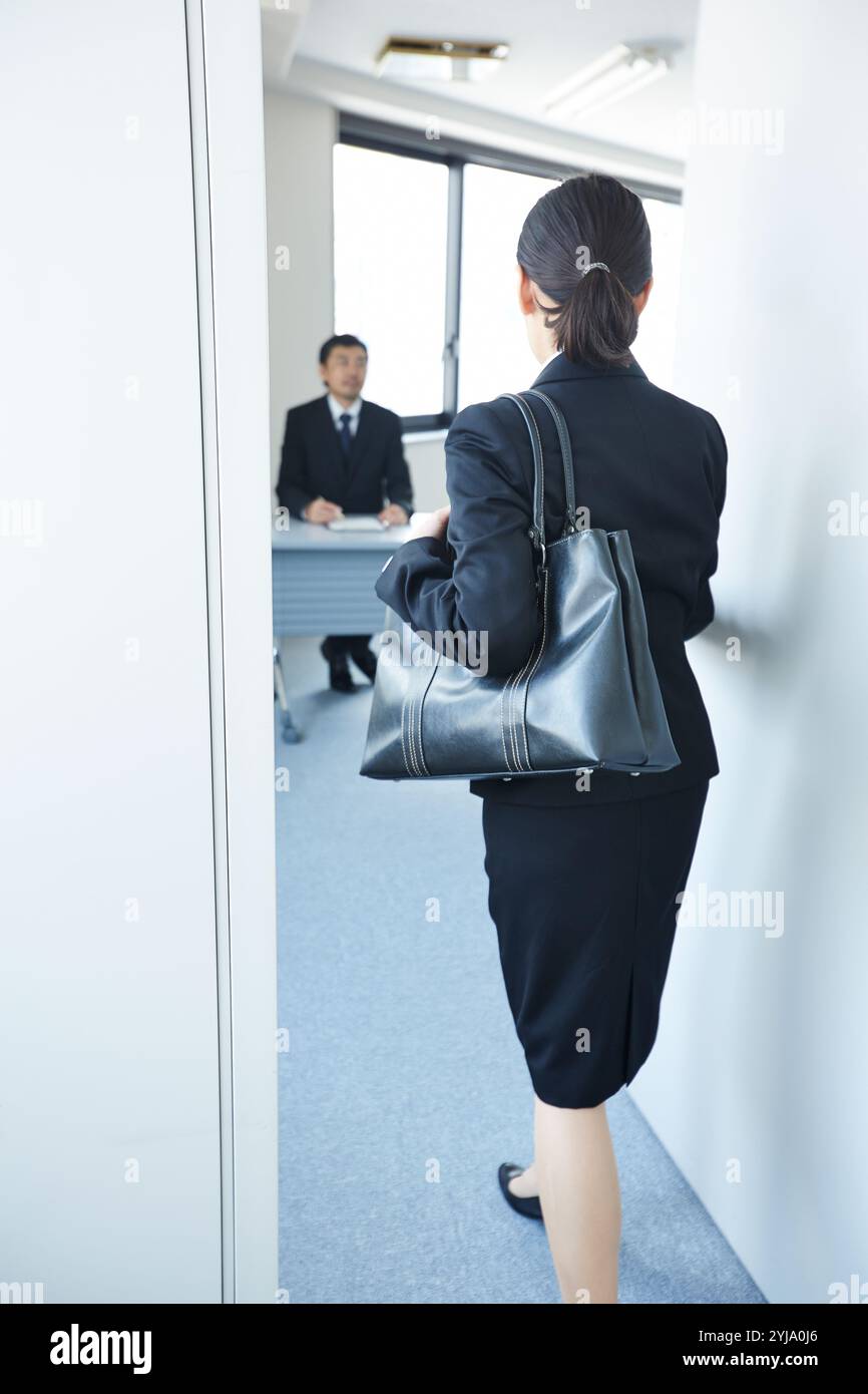 Woman about to enter the interview room stock photo alamy