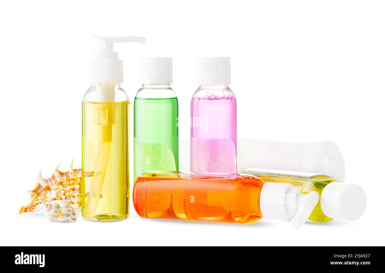 Assorted skincare products displayed on a white surface with a seashell Stock Photo