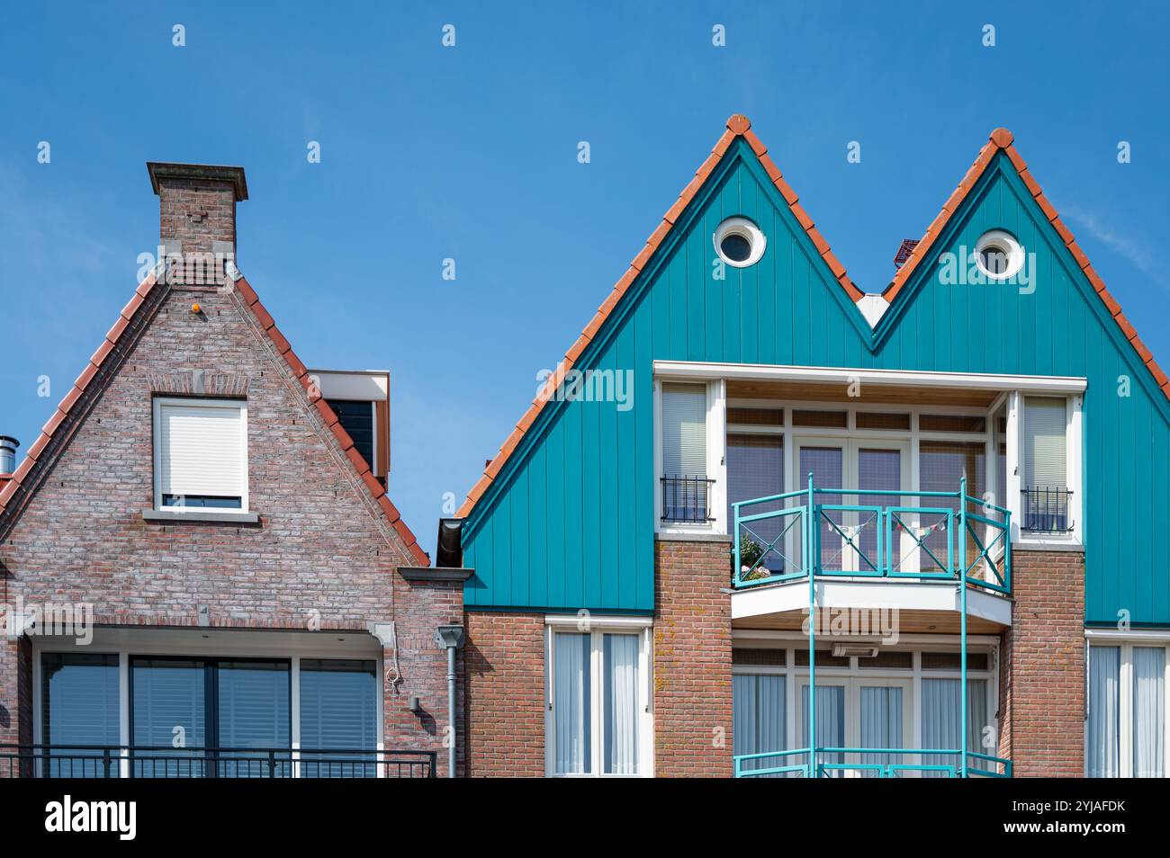blue wooden house with windows and blue sky Stock Photo - Alamy
