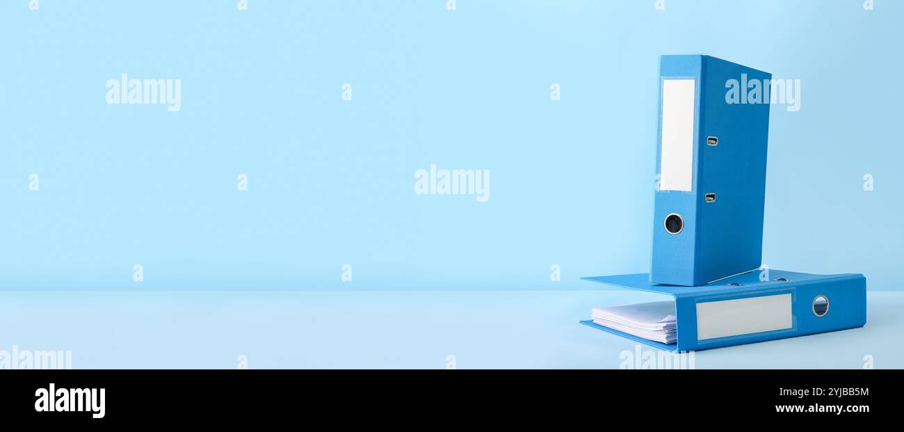 Office folders on light blue background with space for text Stock Photo