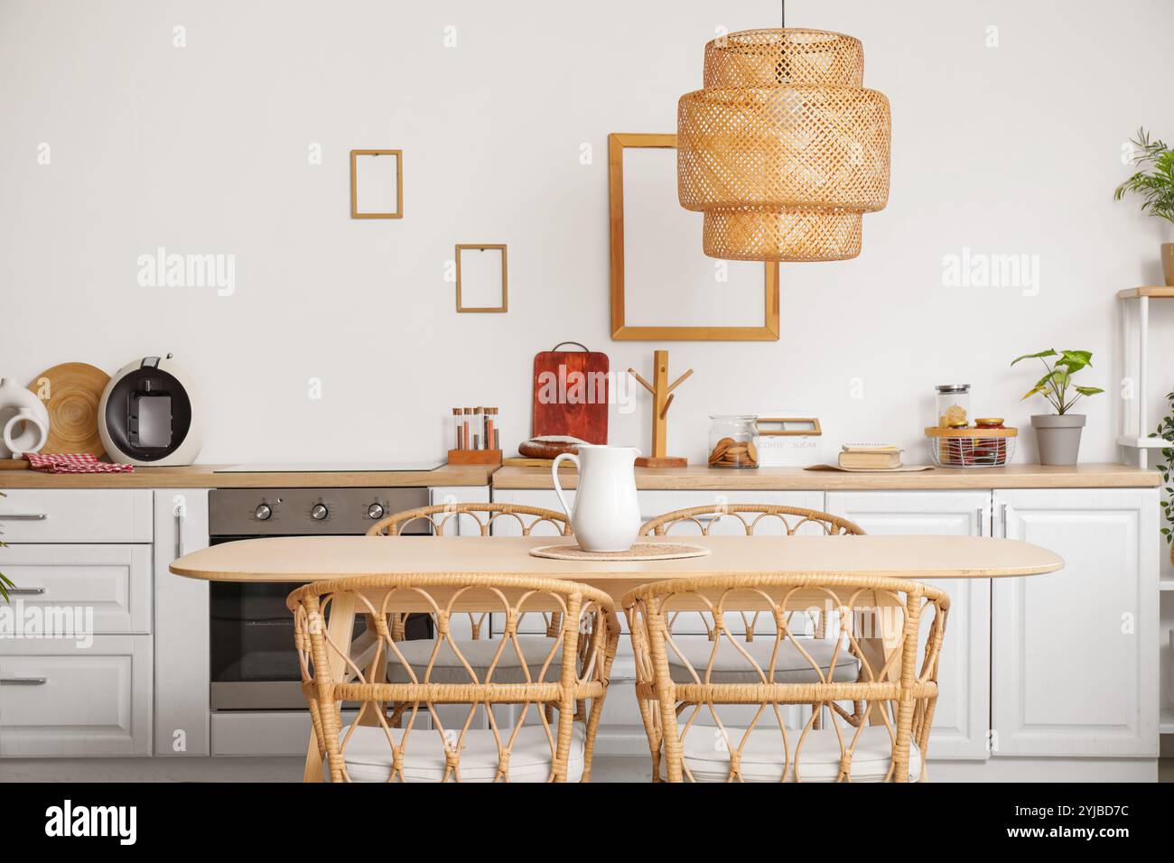 Dining table and chairs in interior of modern kitchen Stock Photo - Alamy