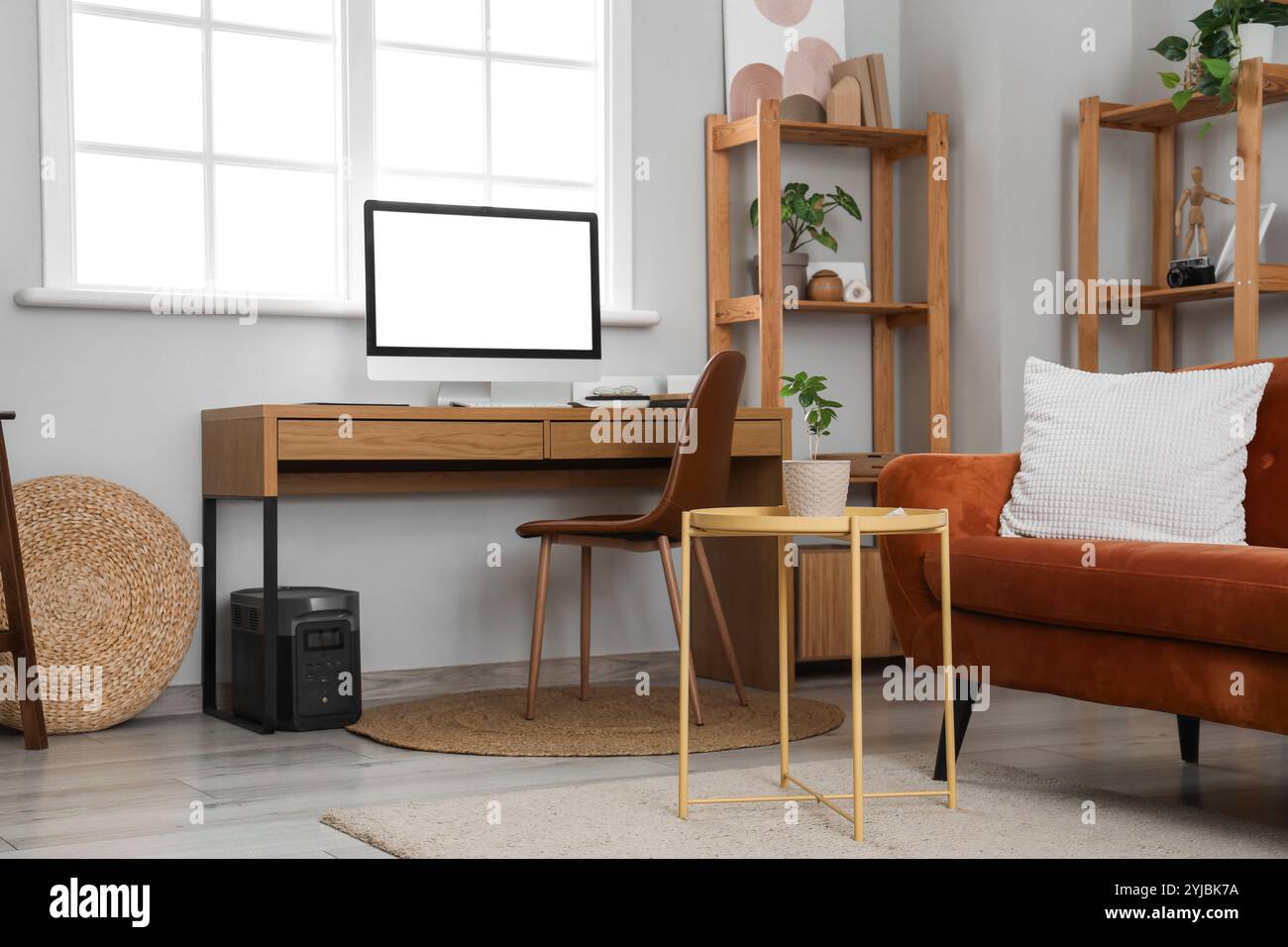 Interior of living room with programmer's workplace Stock Photo