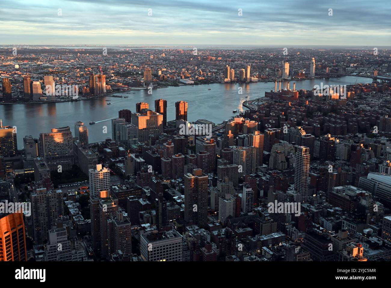 Manhattan Skyline at Sunset Over the East River Stock Photo - Alamy