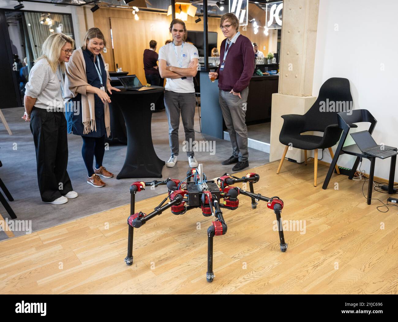 Prague, Czech Republic. 14th Nov, 2024. AI HotSpot: Innovate, Implement, Inspire conference to present various AI innovations including robotic hotel receptionist in Prague, Czech Republic, November 14, 2024. Pictured hexapods robot Daisy of Artificial Intelligence Center Faculty of Electrical Engineering of Czech Technical University in Prague. 2nd left is Rudolf Szadkowski, of Computational Robotics Lab, Credit: Michaela Rihova/CTK Photo/Alamy Live News Stock Photo