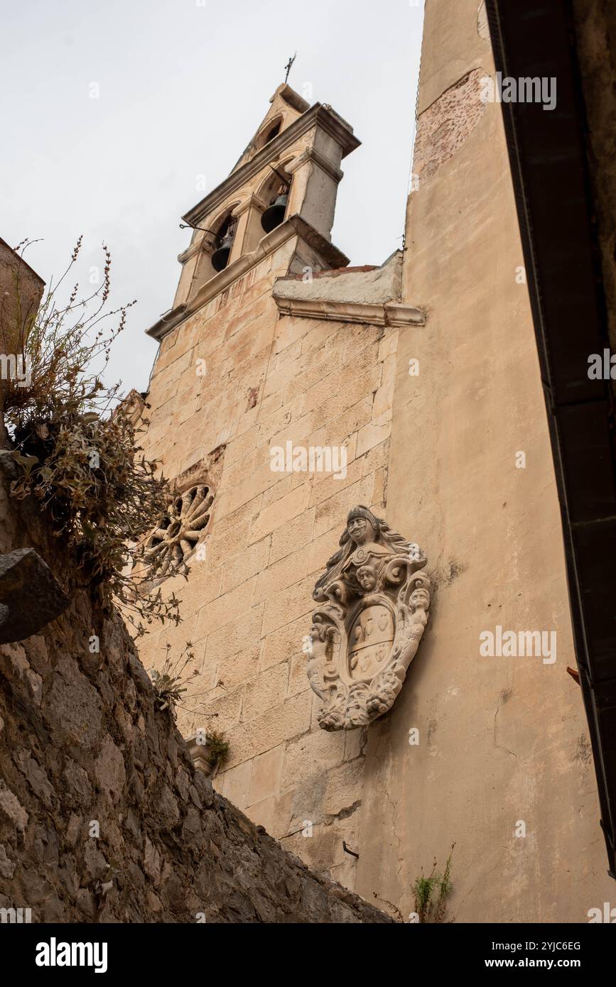 Ancient architecture of Omis, Croatia, showcasing the historical charm of the city with its narrow streets, stone buildings, and medieval structures, Stock Photo