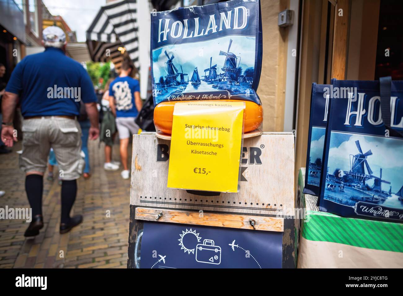 Alkmaar, Netherlands - Aug 30, 2024: Dutch cheese shop featuring surprise cheese bags and windmill-themed totes, highlighting local cheese culture in Alkmaar Stock Photo