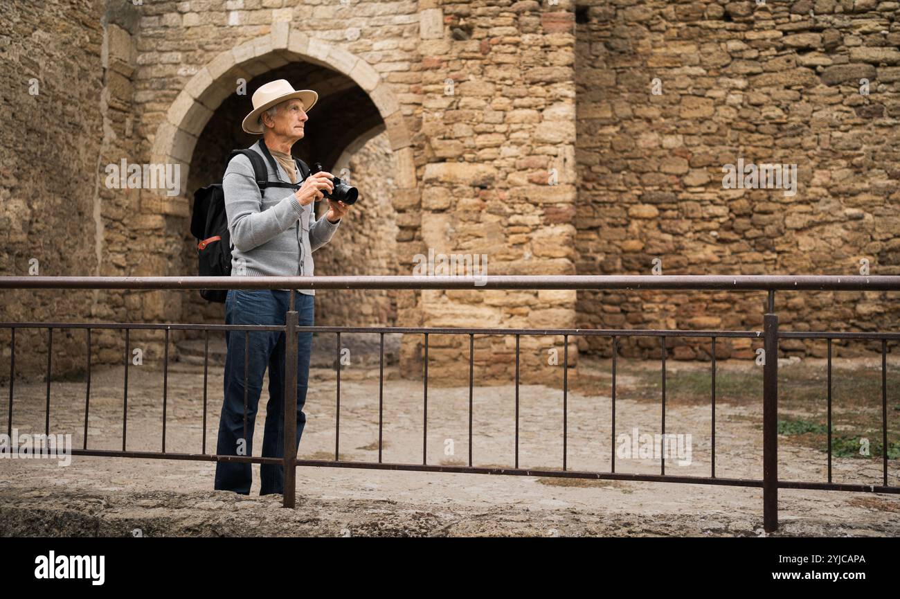 Mature tourist camera walking hi-res stock photography and images - Alamy
