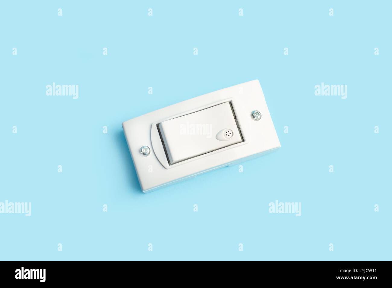 Light switch on a light blue background with copy space Stock Photo