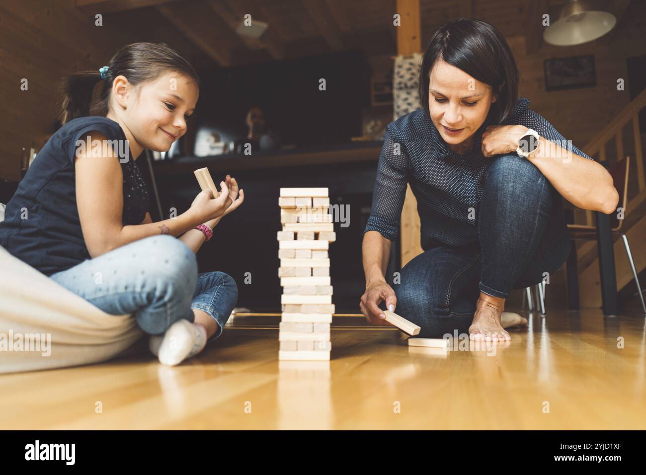 Spening Time Cheerful happy caucasian family spending time together playing games ...