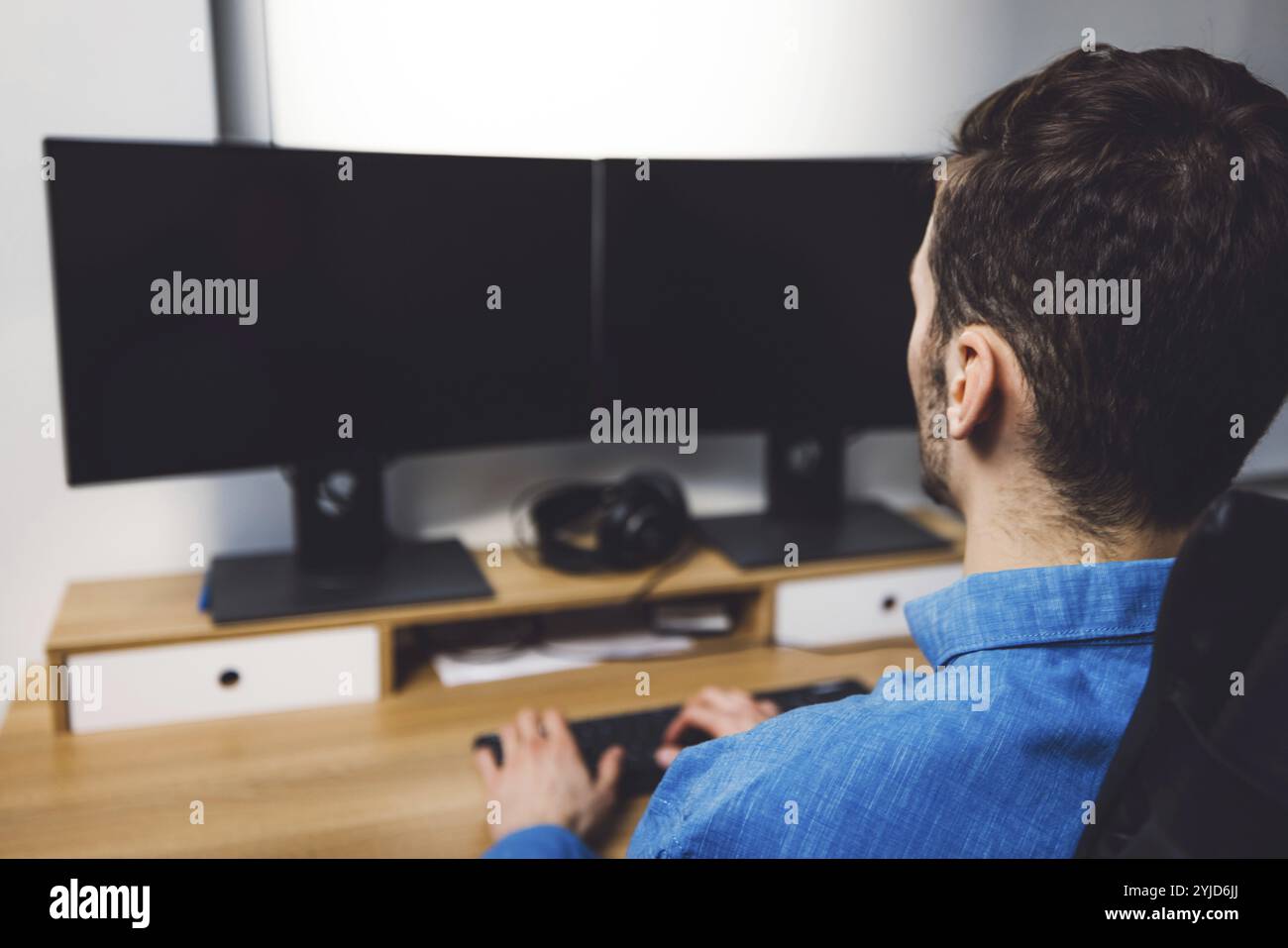 IT Programmer Working on Desktop Computer. Male Specialist Creating Innovative Software Engineer Developing App, Program, Video Game. Terminal with Co Stock Photo