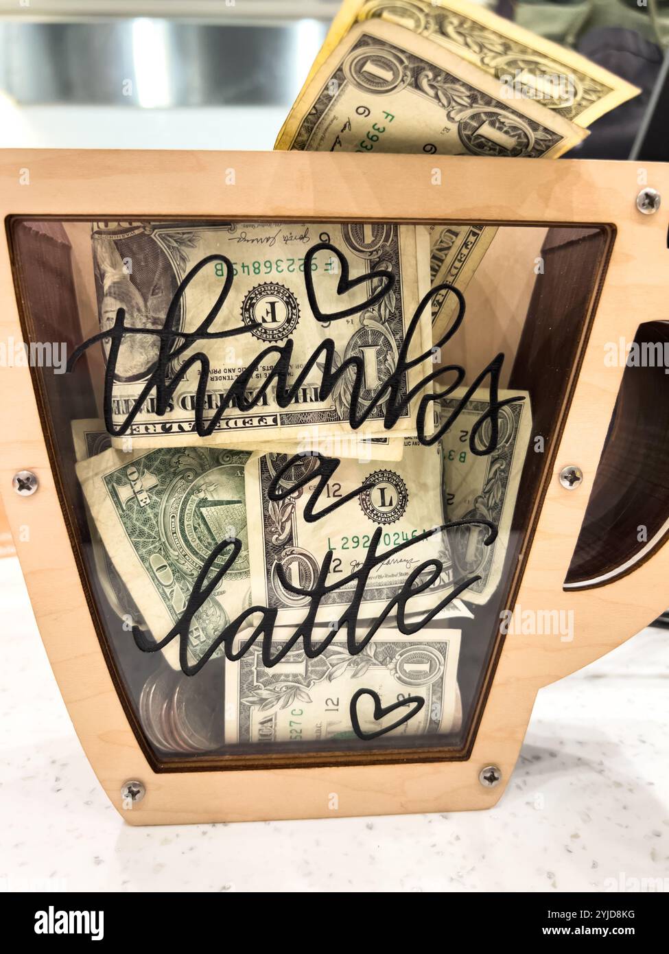 Unique Coffee Shop Tip Jar with Thanks a Latte Design Stock Photo - Alamy