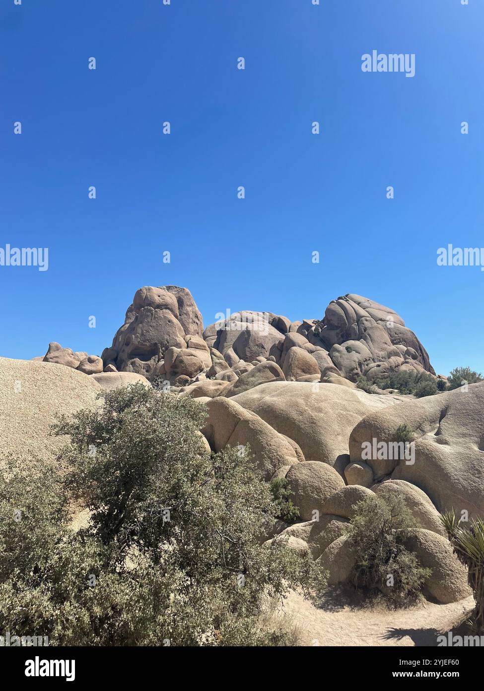 Smooth rock formation in a California desert on a clear sunny day - Smartphone Captured Stock Image