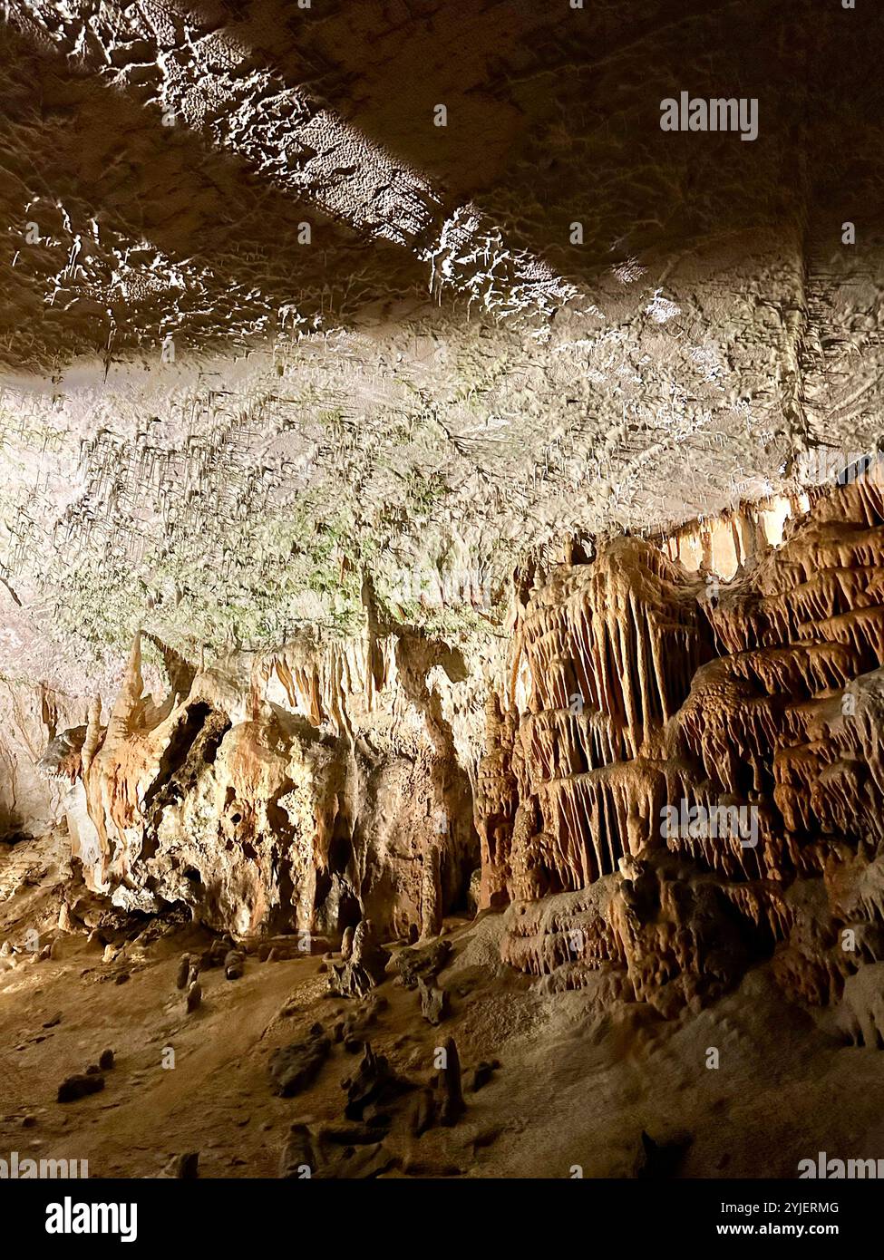 A photography captures a close-up of vibrant stalactites within a secluded cave. - Smartphone Captured Stock Image