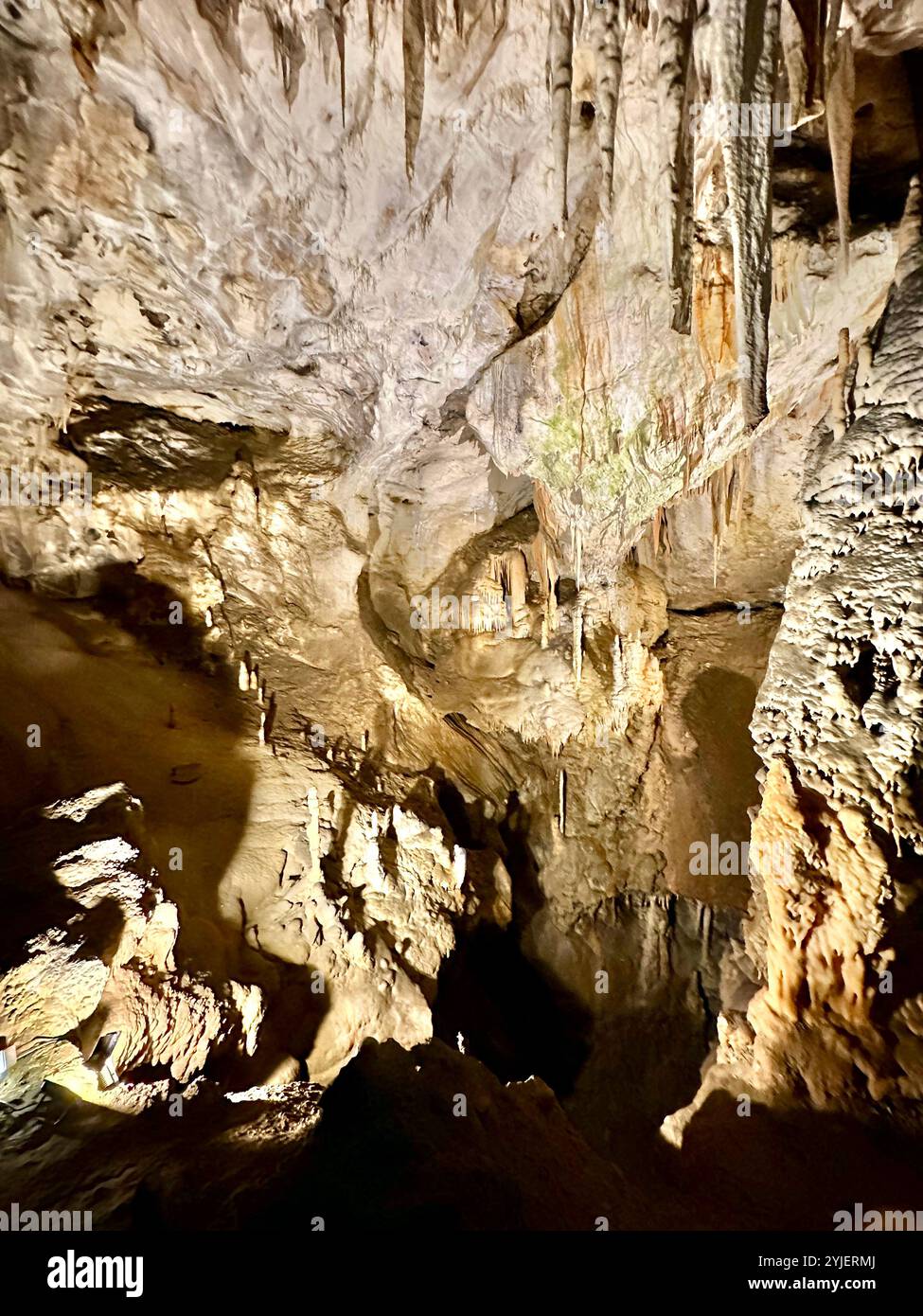 A photography captures a close-up of vibrant stalactites within a secluded cave. - Smartphone Captured Stock Image