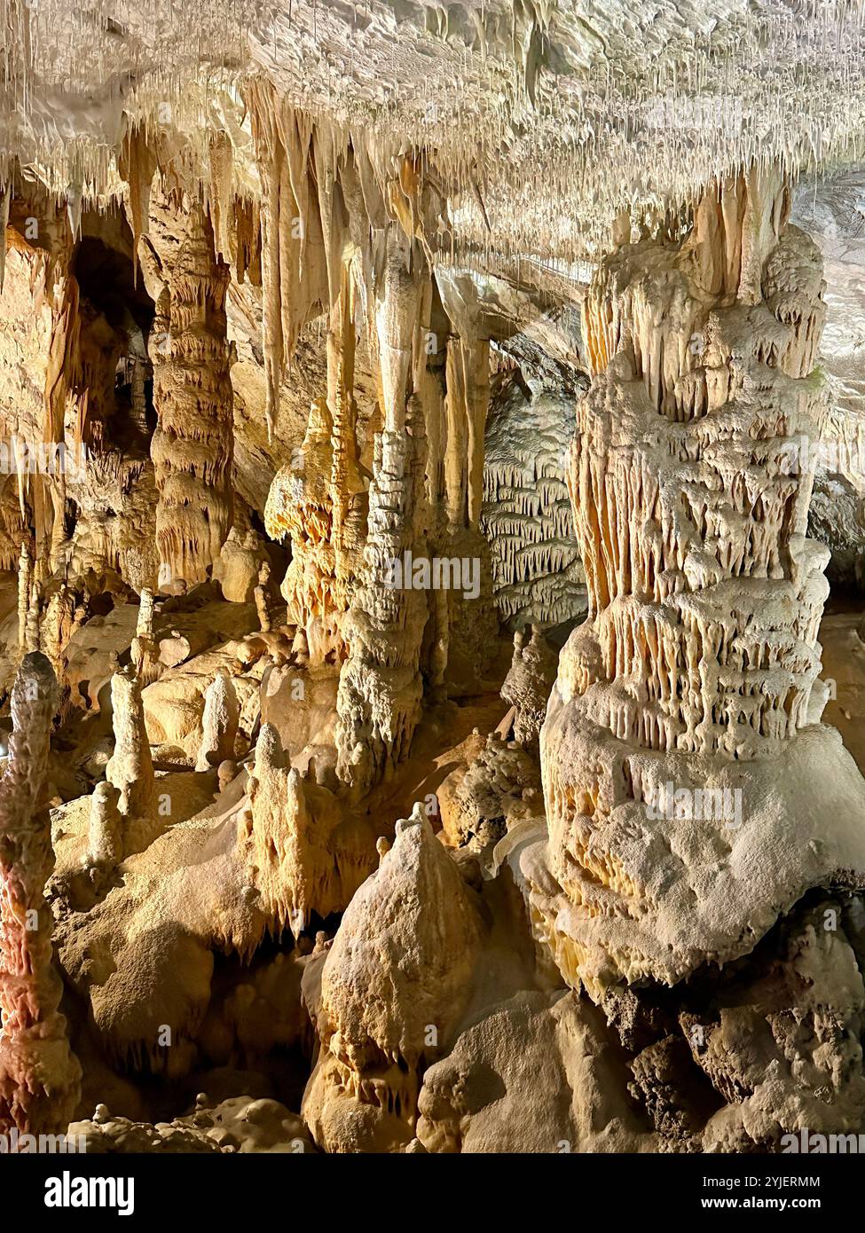 A photography captures a close-up of vibrant stalactites within a secluded cave. - Smartphone Captured Stock Image