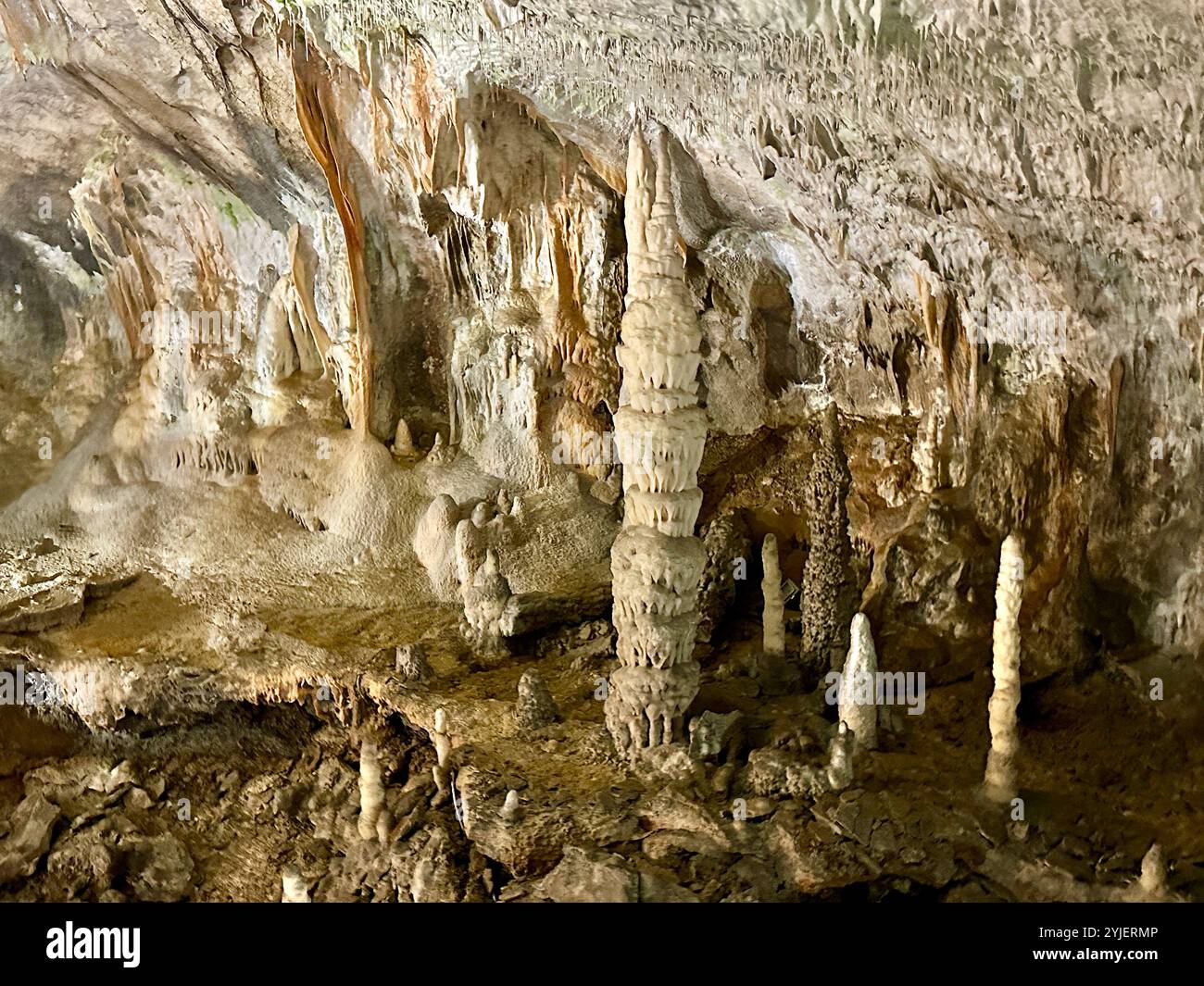 A photography captures a close-up of vibrant stalactites within a secluded cave. - Smartphone Captured Stock Image