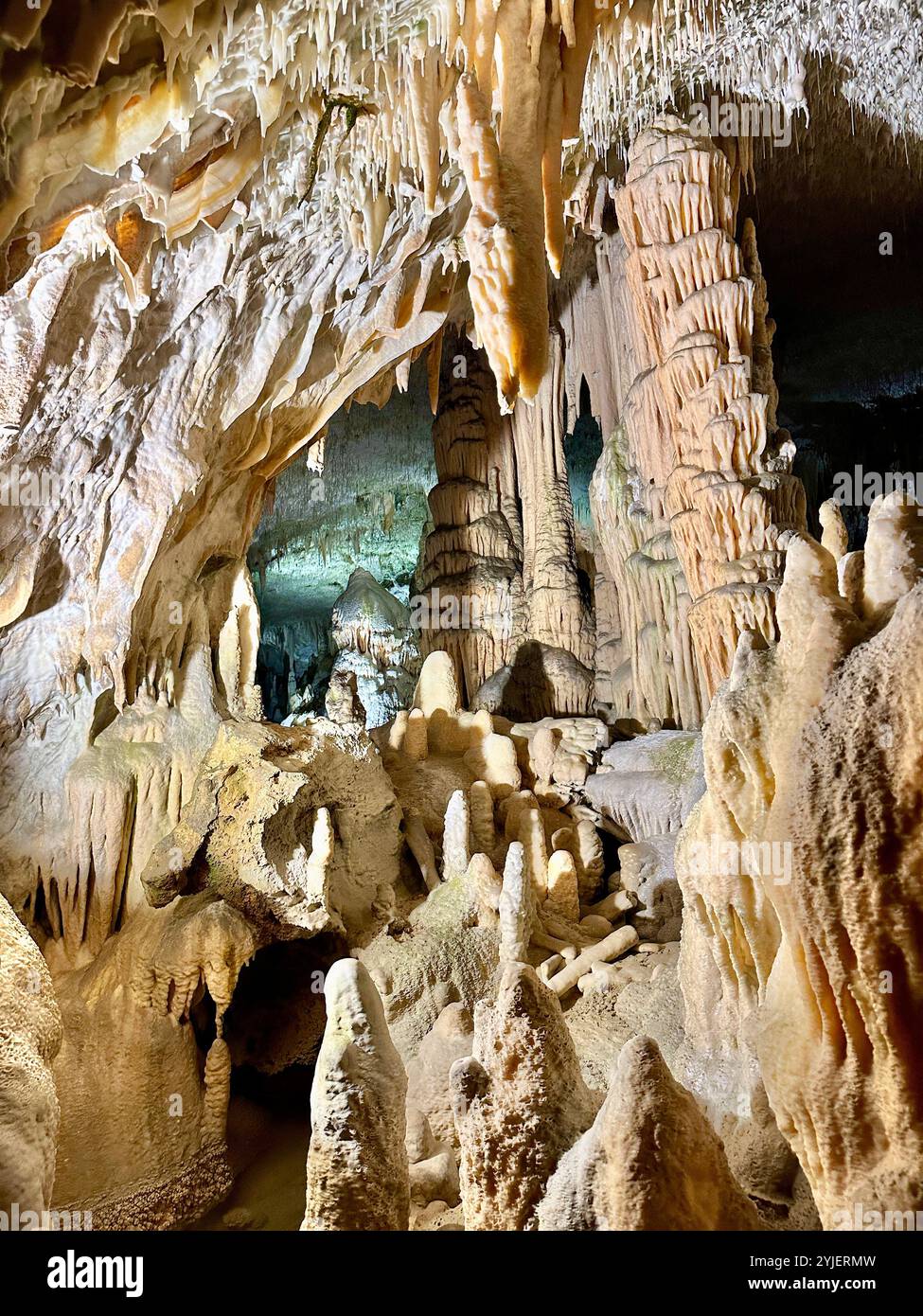 A photography captures a close-up of vibrant stalactites within a secluded cave. - Smartphone Captured Stock Image