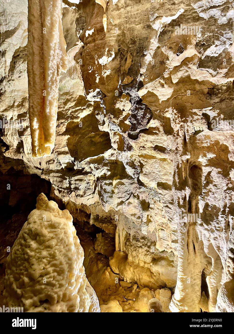 A photography captures a close-up of vibrant stalactites within a secluded cave. - Smartphone Captured Stock Image