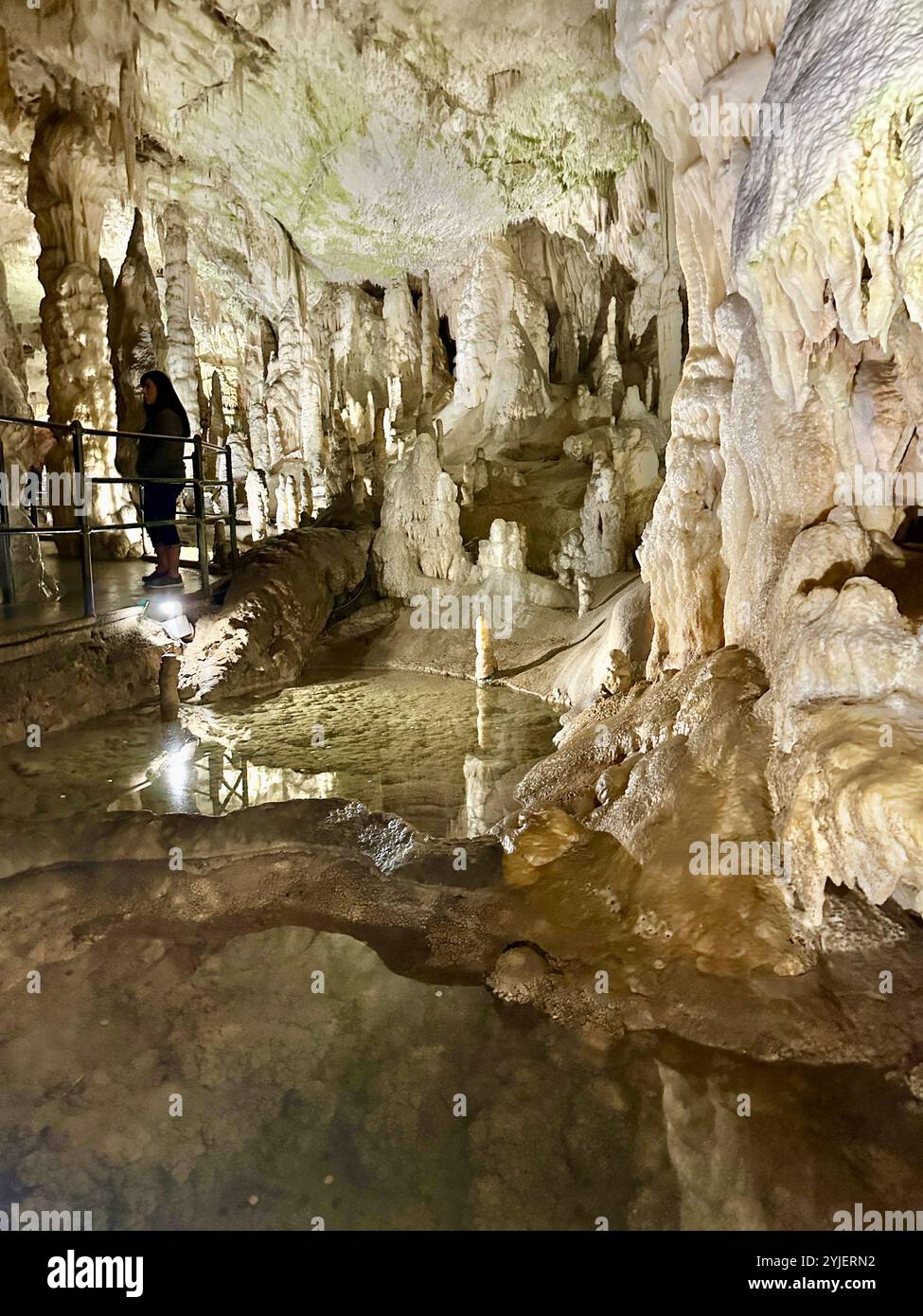A photography captures a close-up of vibrant stalactites within a secluded cave. - Smartphone Captured Stock Image