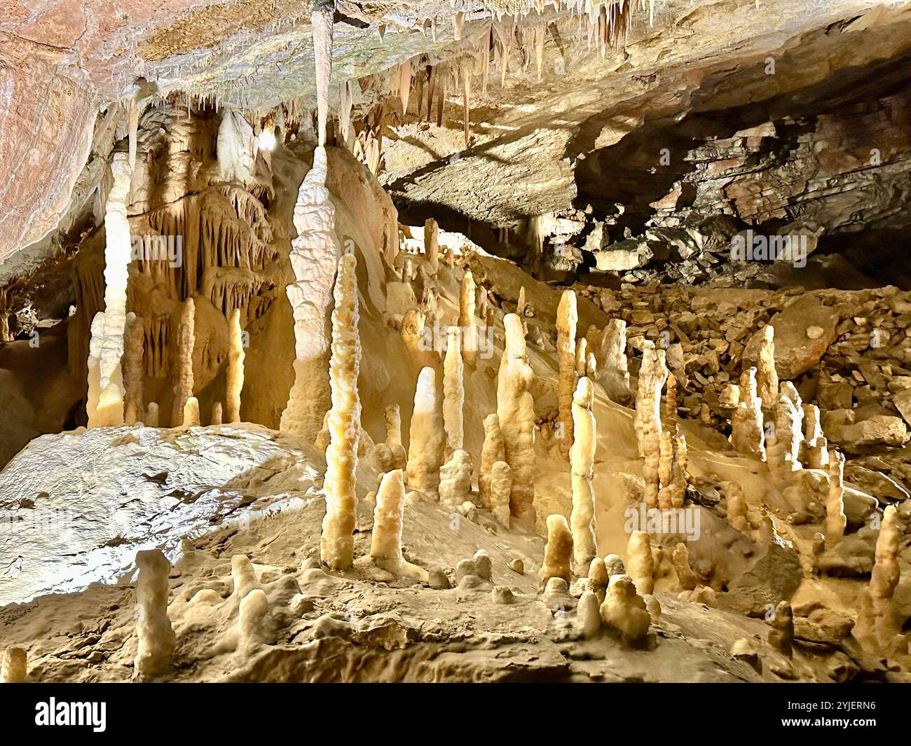 A photography captures a close-up of vibrant stalactites within a secluded cave. - Smartphone Captured Stock Image