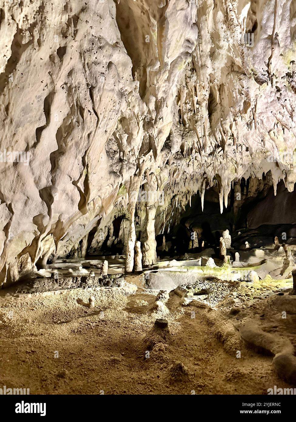 A photography captures a close-up of vibrant stalactites within a secluded cave. - Smartphone Captured Stock Image