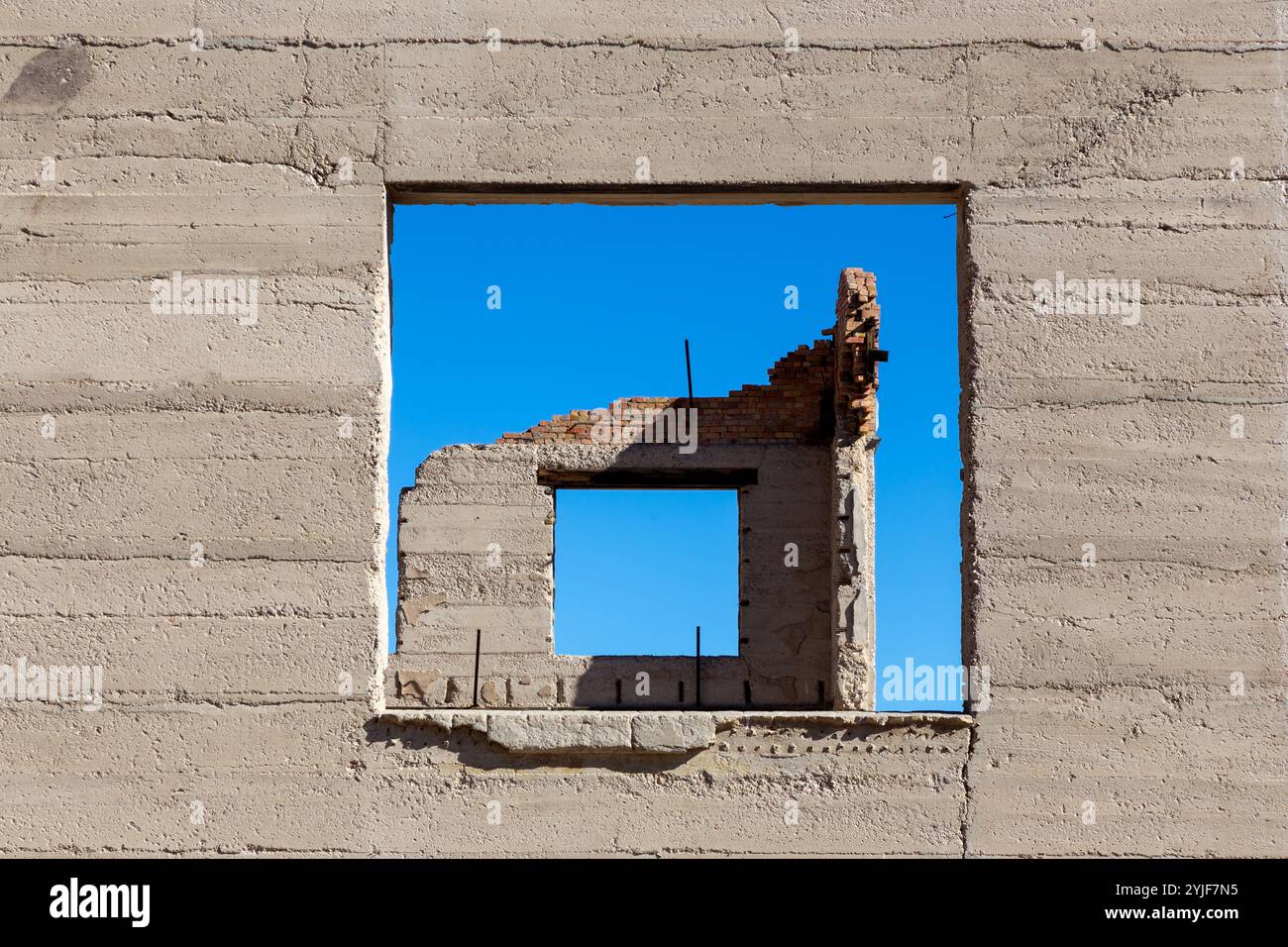 Symmetric Wall Window Architecture View, Old Bank Building Facade Demolished Ruin, Gold Rush Relic, Historic Rhyolite Mining Ghost Town Nevada USA Stock Photo