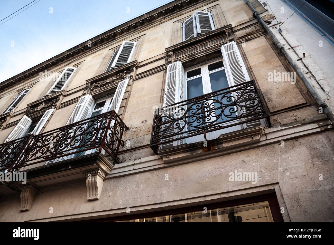 This traditional French building in Bordeaux showcases stone ...