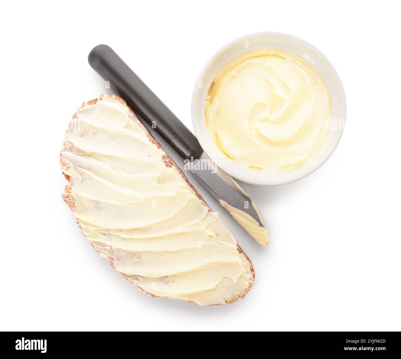 Bread slice and bowl with fresh butter on white background Stock Photo ...