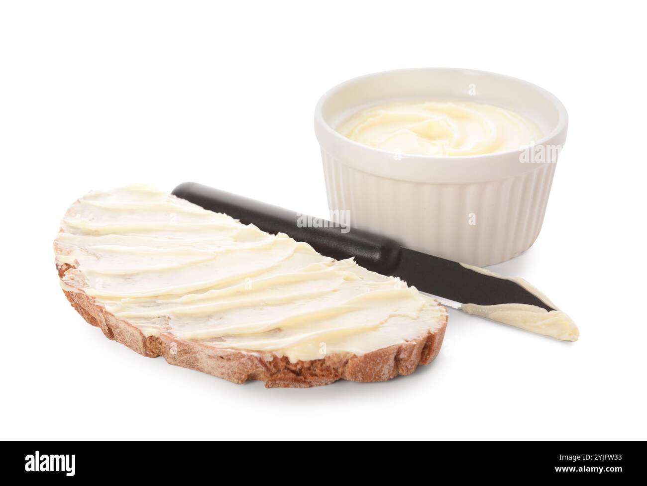 Bread slice and bowl with fresh butter on white background Stock Photo ...
