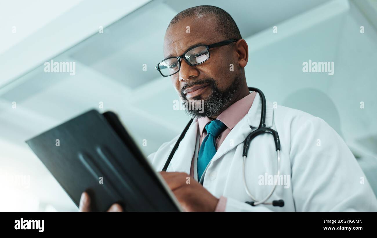 Black male patient black doctor hi-res stock photography and images - Alamy