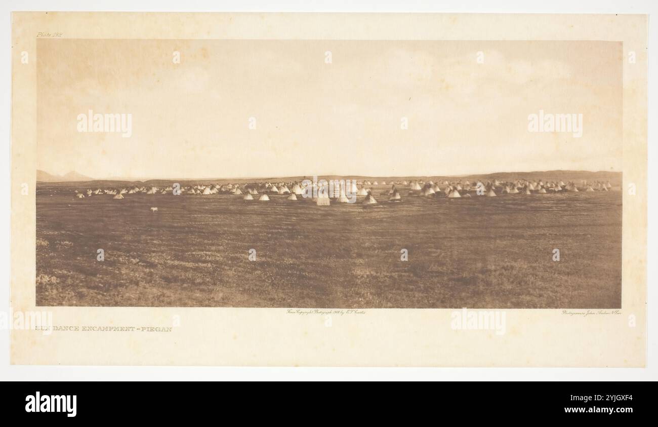 Sun Dance Encampment-Piegan. Edward S. Curtis; American, 1868-1952. Date: 1900. Dimensions: 15.8 x 34.6 cm (image); 20.9 x 37.6 cm (paper); 45.9 x 56 cm (mount). Photogravure, plate 192 from 'The North American Indian, Volume 6' (1911). Origin: United States. Museum: The Chicago Art Institute, FLORENCIA, USA. Author: Edward S. Curtis. Stock Photo