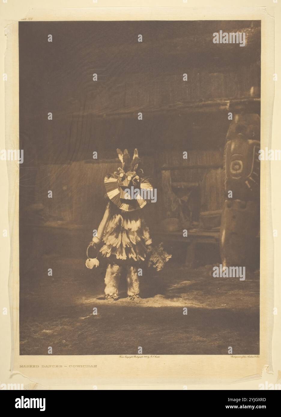 Masked Dancer - Cowichan. Edward S. Curtis; American, 1868-1952. Date: 1912. Dimensions: 38.6 x 27.7 cm (image); 43.6 x 31.1 cm (paper). Photogravure, plate 326 from 'The North American Indian, Volume 9' (1913). Origin: United States. Museum: The Chicago Art Institute, FLORENCIA, USA. Author: Edward S. Curtis. Stock Photo