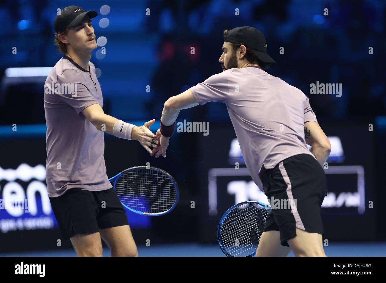 Turin, Italy. 14th Nov, 2024. Jordan Thompsos of Australia (R) shakes hand with Max Purcell of Australia (L) during the Round Robin doubles match between Marcel Granollers of Spain and Horacio Zeballos of Argentina against Max Purcell of Australia and Jordan Thompson of Australia on day five of the Nitto ATP finals 2024 at Inalpi Arena on November 14, 2024 in Turin, Italy. Credit: Marco Canoniero/Alamy Live News Stock Photo