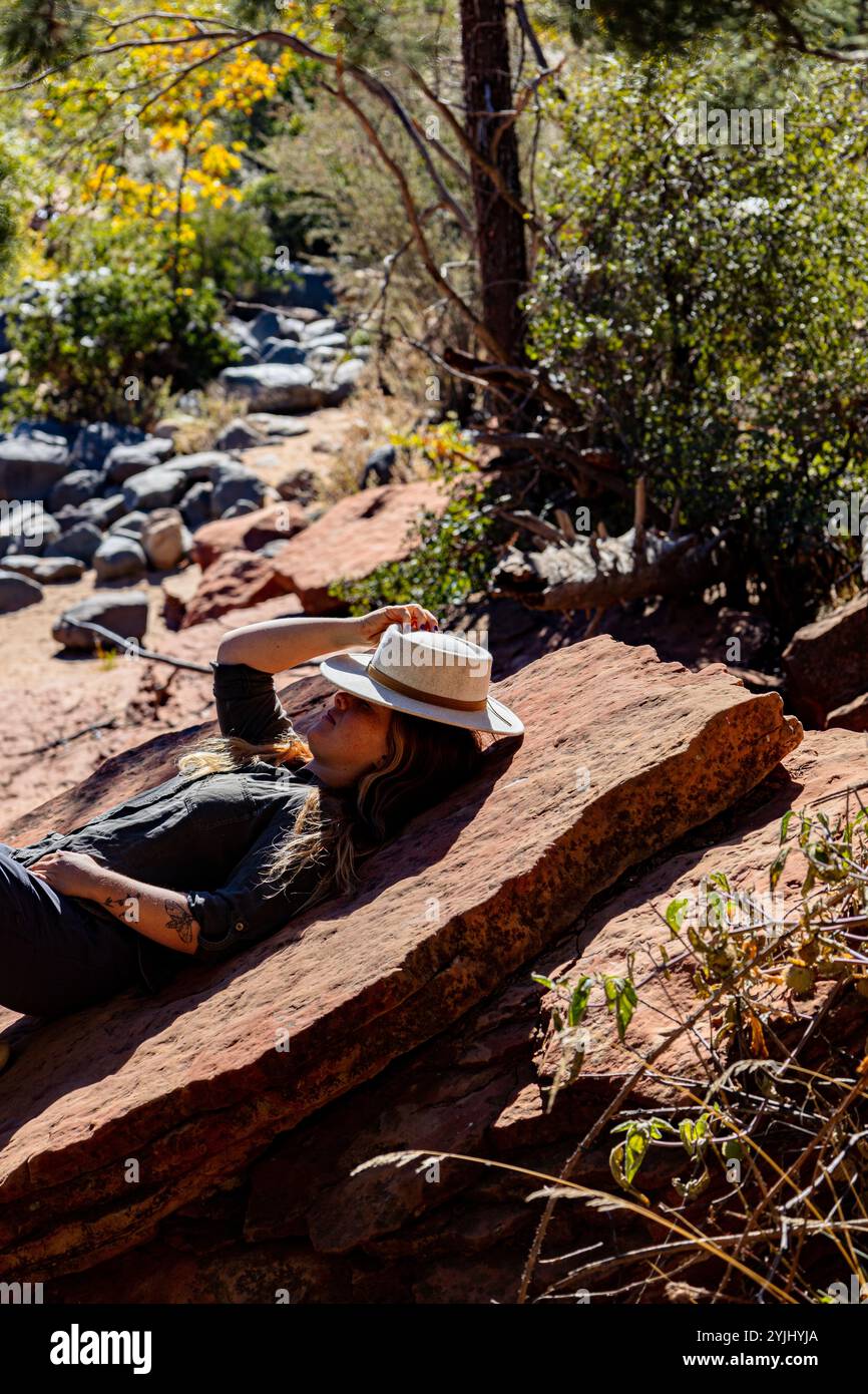 Picture of Woman relaxing in the shade immersed in nature Stock Photo - Alamy