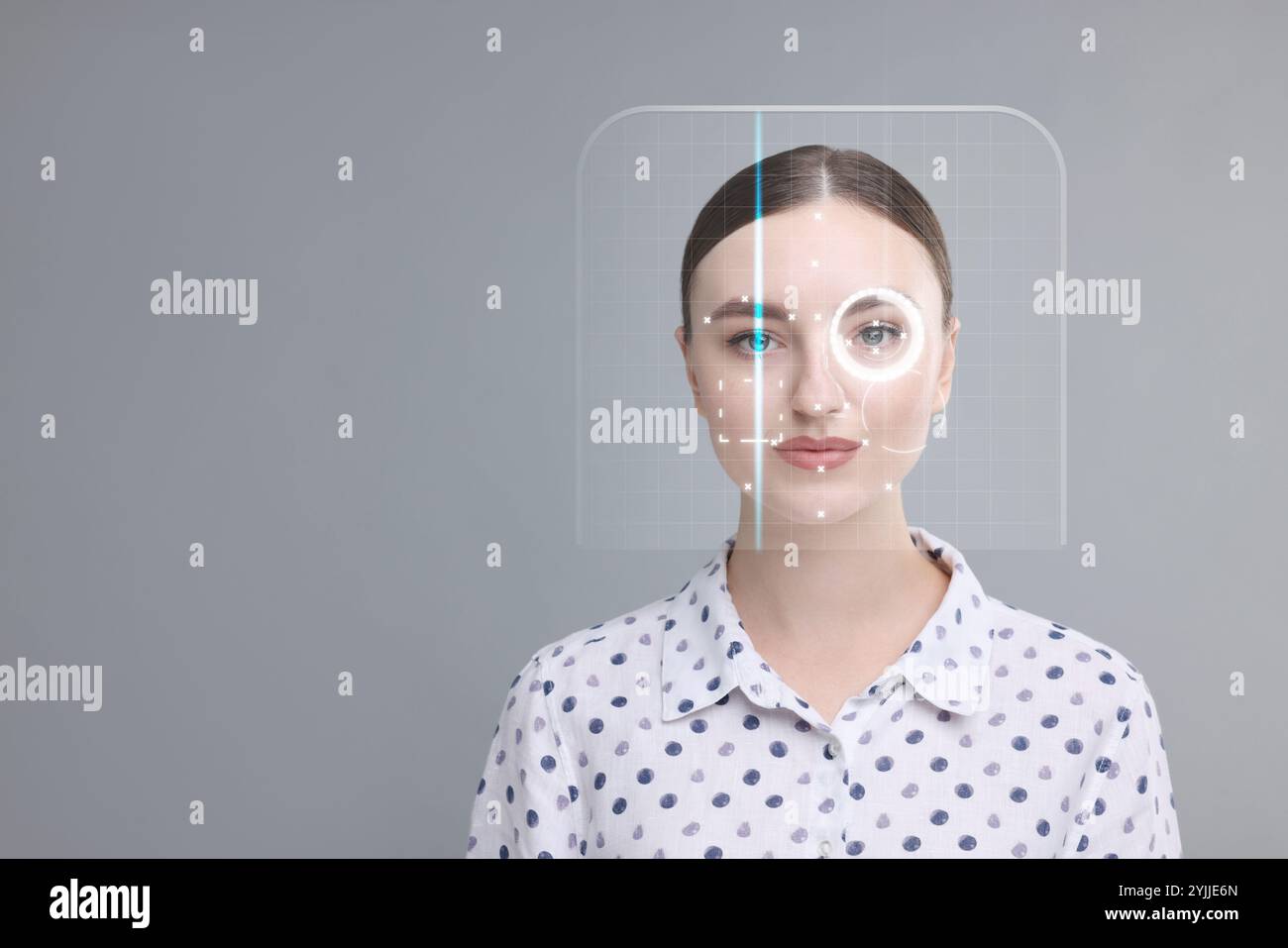 Facial and iris recognition system. Woman undergoing biometric ...