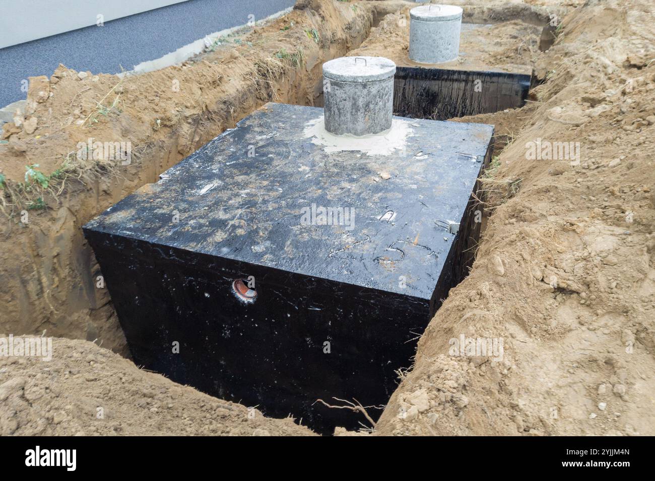 Installation of multiple domestic wastewater tanks in construction site Stock Photo