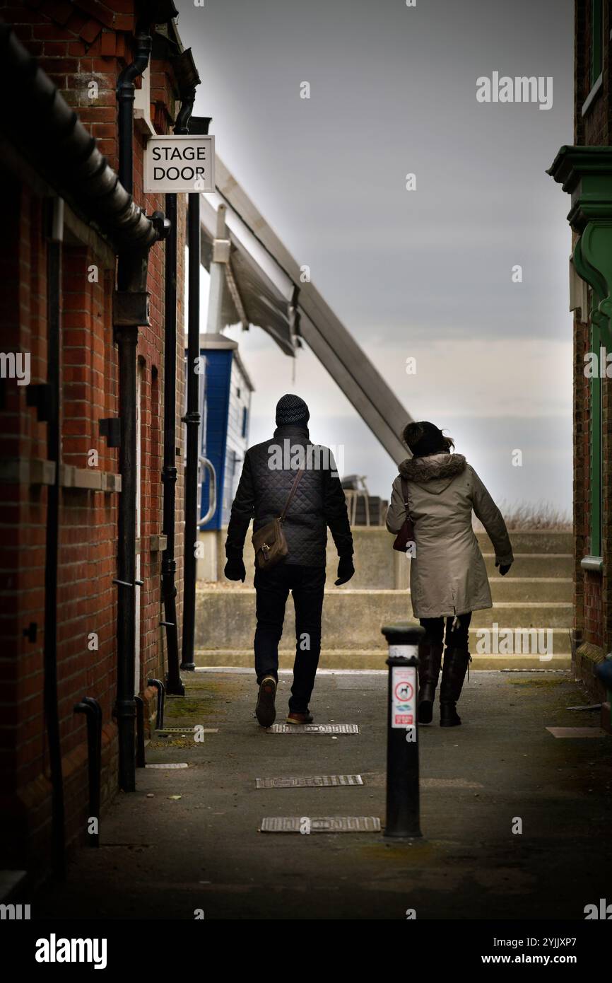 couple outside stage door theatre aldeburgh suffolk england Stock Photo