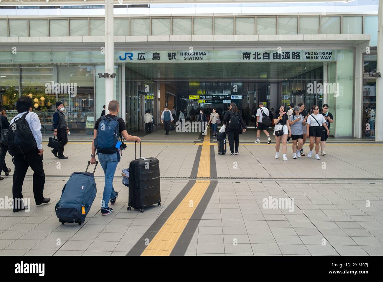 Passengers enter the Railway Station in Hiroshima Japan Stock Photo - Alamy