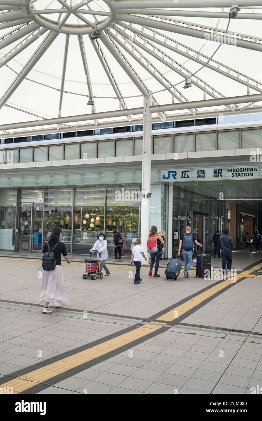 Passengers enter the Railway Station in Hiroshima Japan Stock Photo - Alamy
